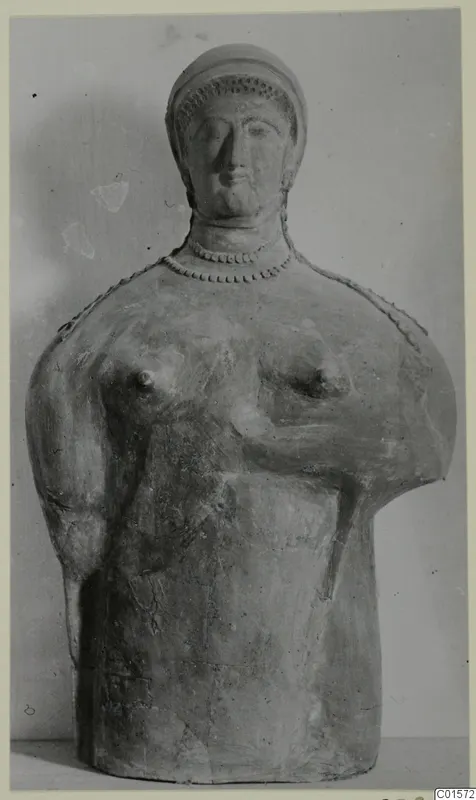 Terracotta bust of a figure with a cap-like headdress and a beaded necklace, from Vouni
