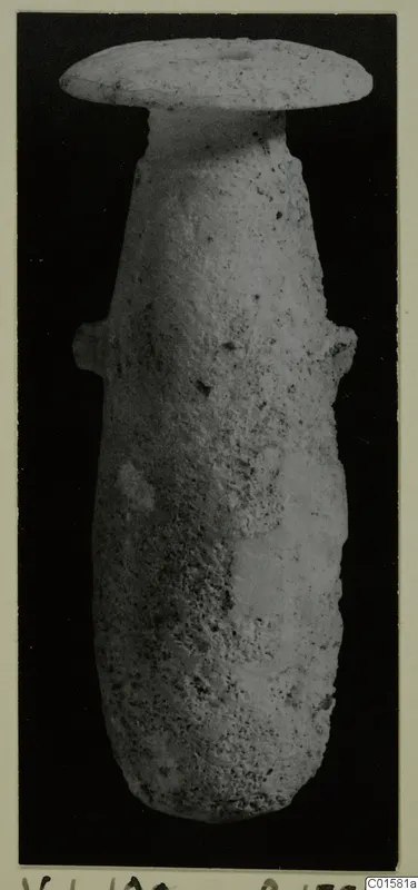 Stone vase from Vouni with a flat disc-shaped rim and two small lug handles, photographed upright