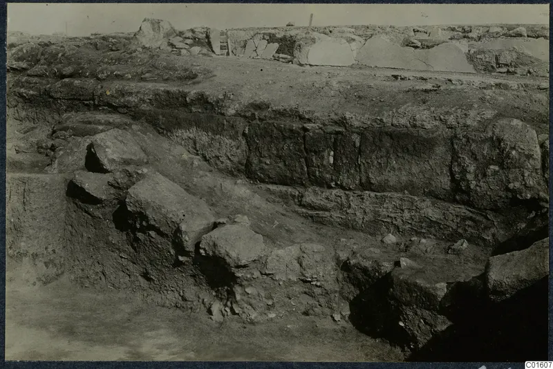 Excavated area at Vouni palace with large cut stone blocks and layered earth banks