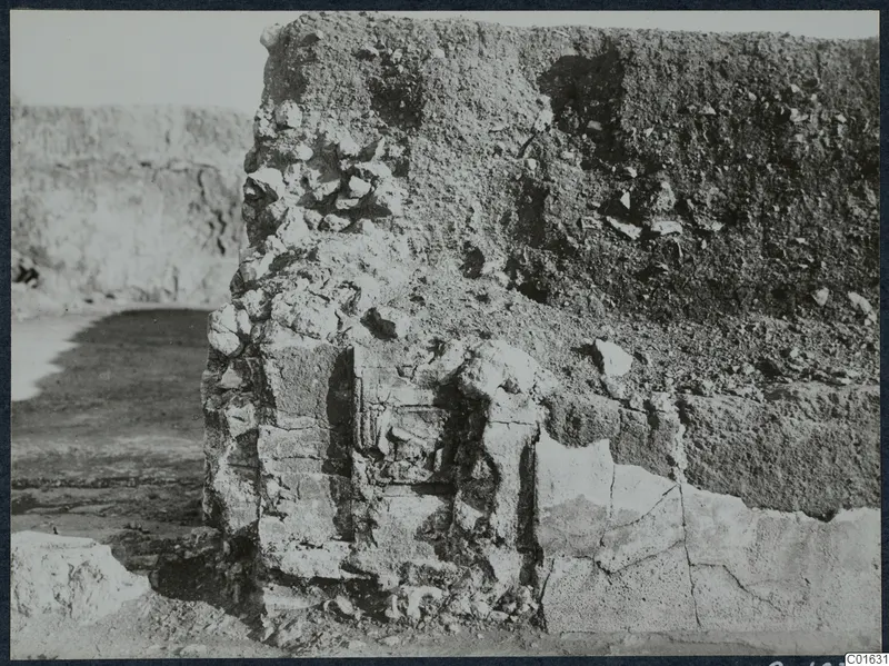 Excavated wall with loose stones and rubble at the palace at Vouni