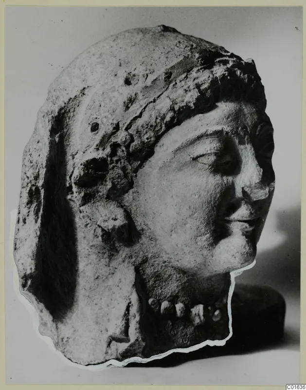 Head of a woman from Vouni in profile view, with a close-fitting headdress and a row of beads at the neck.