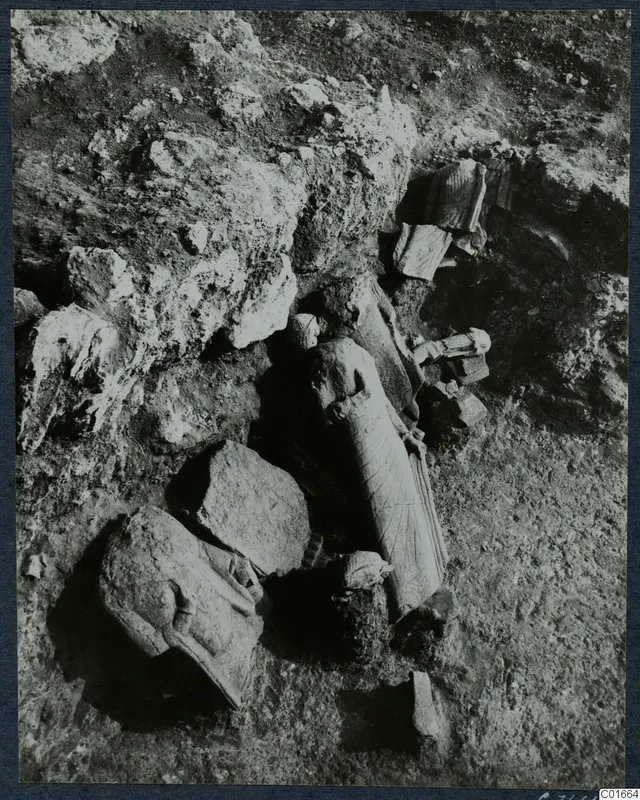 Statues lying in the soil in Room 129 at Vouni, seen from above during excavation