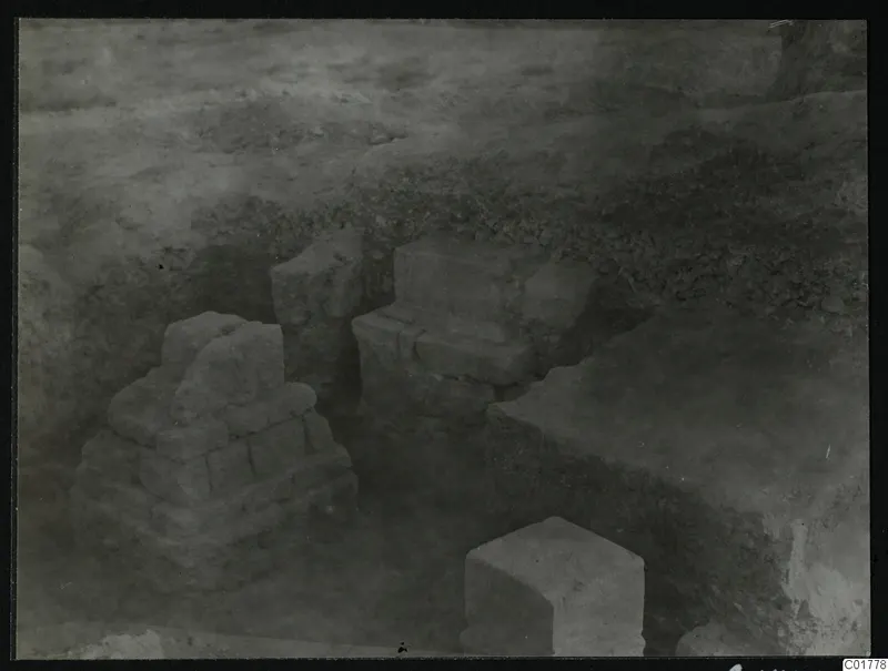 Stone pedestals and squared blocks standing in an excavation at Kition