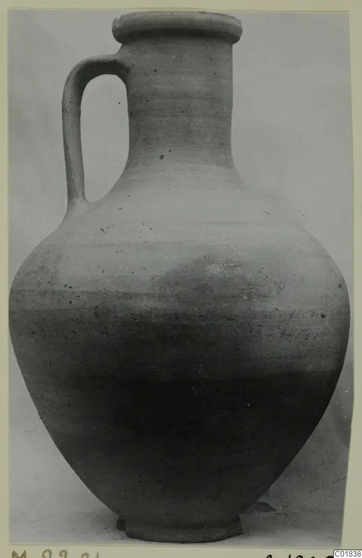 Jug of Pottery Plain White VII with a single loop handle and a ring base