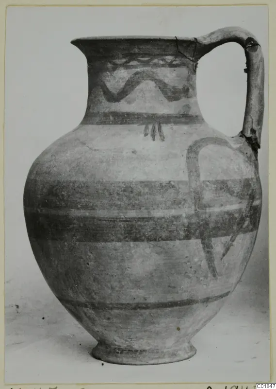 White Painted VI jug with a long strap handle and painted wavy and horizontal bands