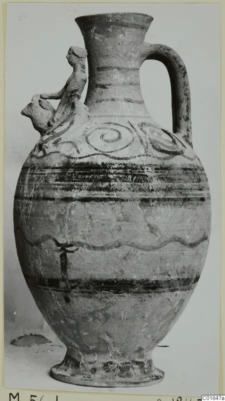 Pottery jug, White Painted VI, with dark painted bands, spiral motifs and a modelled figure applied to the shoulder