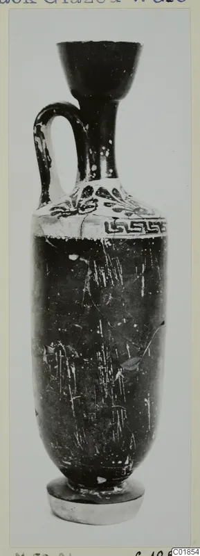 Black Glazed Ware lekythos with one handle, a flared mouth and a white band with dark motifs and a key pattern near the shoulder.