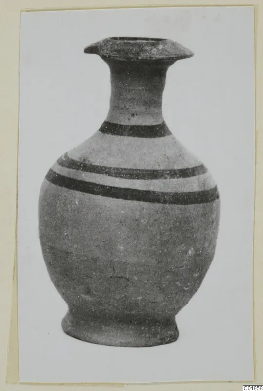 Pottery White Painted VII vessel with a flared mouth, tall neck and dark painted bands on its body