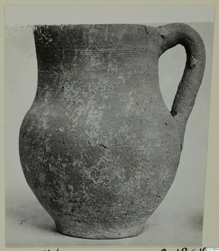 Pottery jug with a single loop handle, catalogued as Pottery Plain White VI