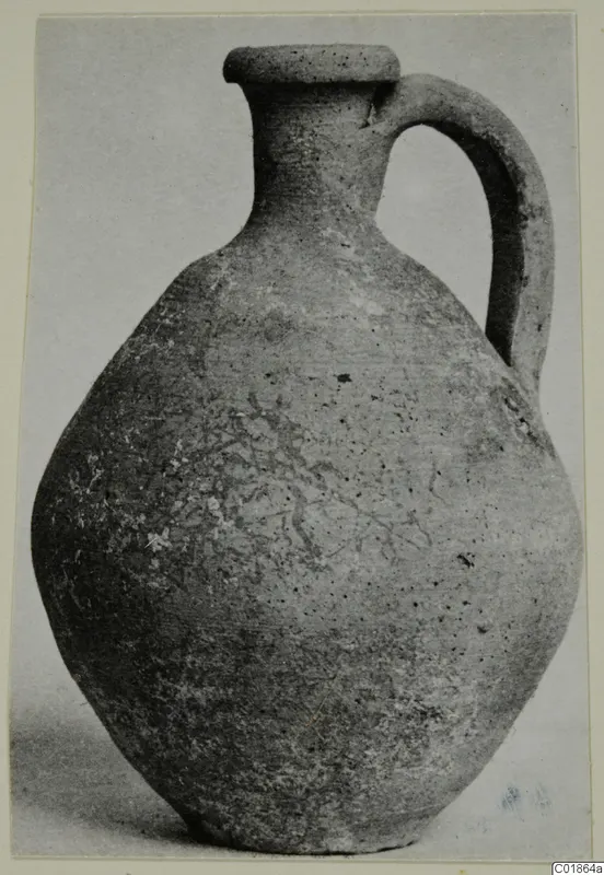 Pottery Plain White VI juglet with a flat rim and a single loop handle