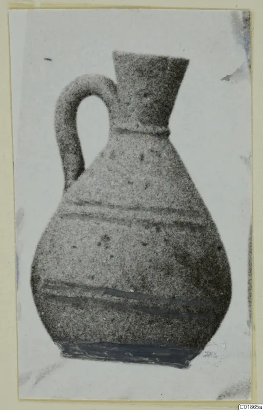 Pottery White Painted VI jug with a loop handle and flaring neck, shown with dark painted bands