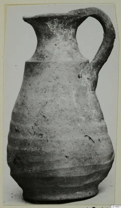 Pottery jug with a single loop handle and grooved lower body, from Marion