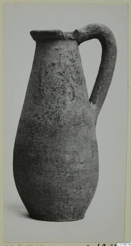 Pottery Plain White VI jug with a single strap handle and flared rim, from the Marion tomb finds