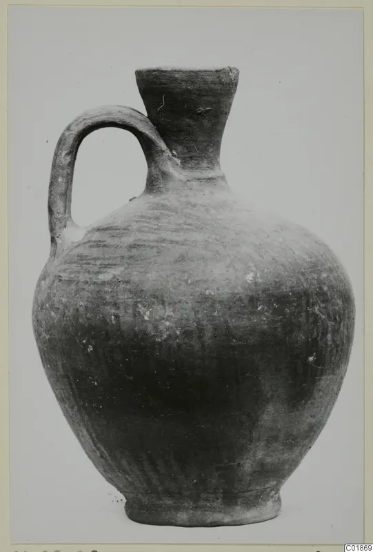 Jug in Pottery Stroke Polished Ware with a single loop handle, from Marion