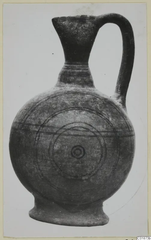 Pottery Black-on-Red III_V - V_VII jug with a single handle, decorated with concentric circles and horizontal bands