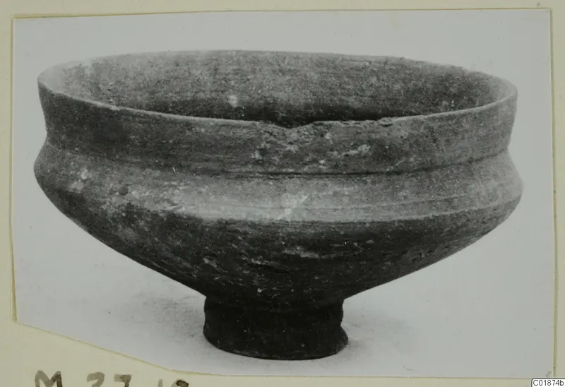 Pottery bowl with a wide open mouth, a thickened rim and a short ring foot.