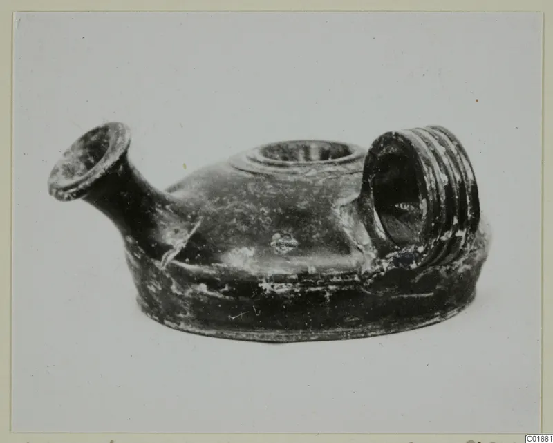 Black glazed guttus from Marion, side view showing spout, filling hole and ribbed handle