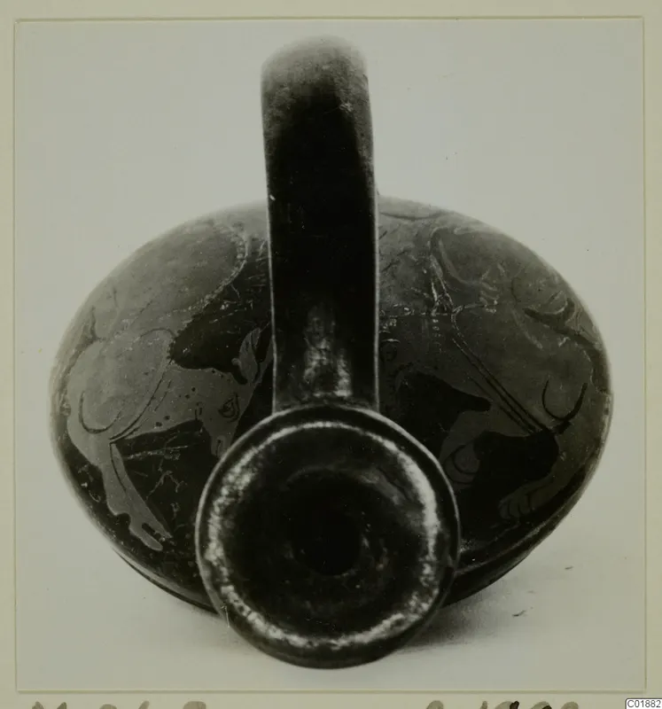 Pottery Red Figured Ware vessel with a single strap handle, photographed from the front with its mouth facing the camera