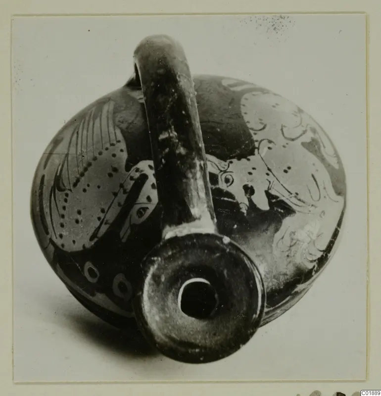 Red-figured pottery vessel with a tall handle and wide mouth, photographed from above at an angle