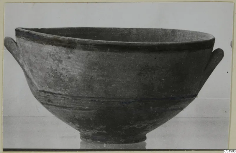 Black-on-Red bowl from the Kastros tombs at Lapithos, with two small side handles and dark painted bands