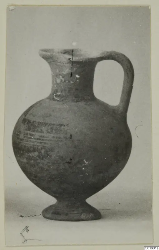 Pottery jug, White Painted I-II, from Lapithos Kastros tomb finds, with a loop handle and painted bands on the body.