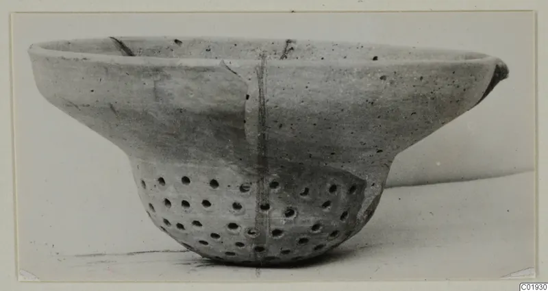 Plain White pottery bowl with a pierced lower body, from the Kastros tombs at Lapithos