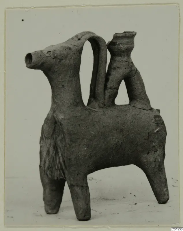 Clay vessel modelled as a four-legged animal, with a tubular spout at the head and a strap handle, from Lapithos