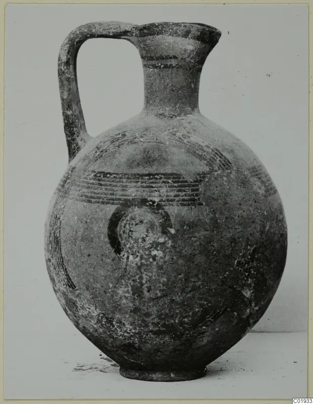 Round-bodied jug with a strap handle and dark painted bands, from the Kastros tombs at Lapithos