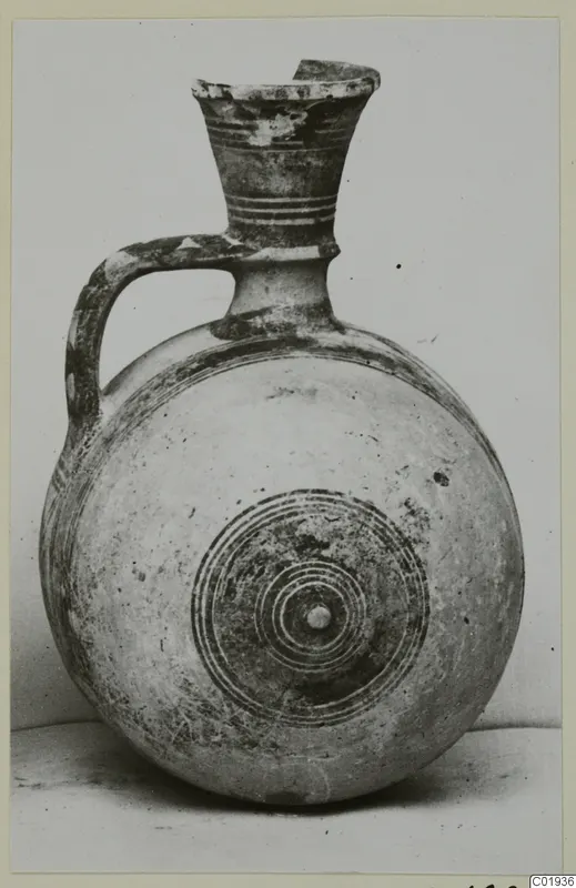 Pottery Bichrome II jug from Lapithos, with a round body and concentric circles painted on its front