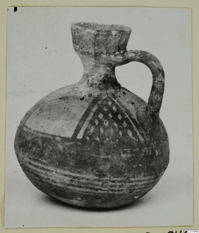 White Painted I jug from Lapithos, with a single loop handle, painted bands and a lozenge panel on the shoulder