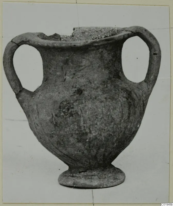 Two-handled pottery vessel with a broken rim, from the Kastros tombs at Lapithos