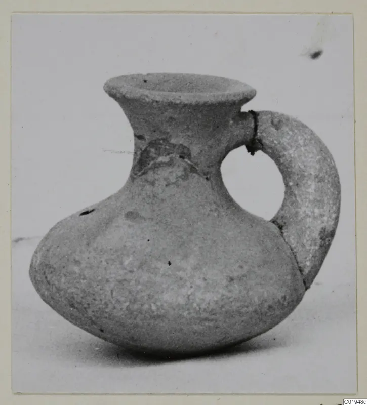 Small jug with a flared rim and single loop handle, from the Kastros tombs at Lapithos