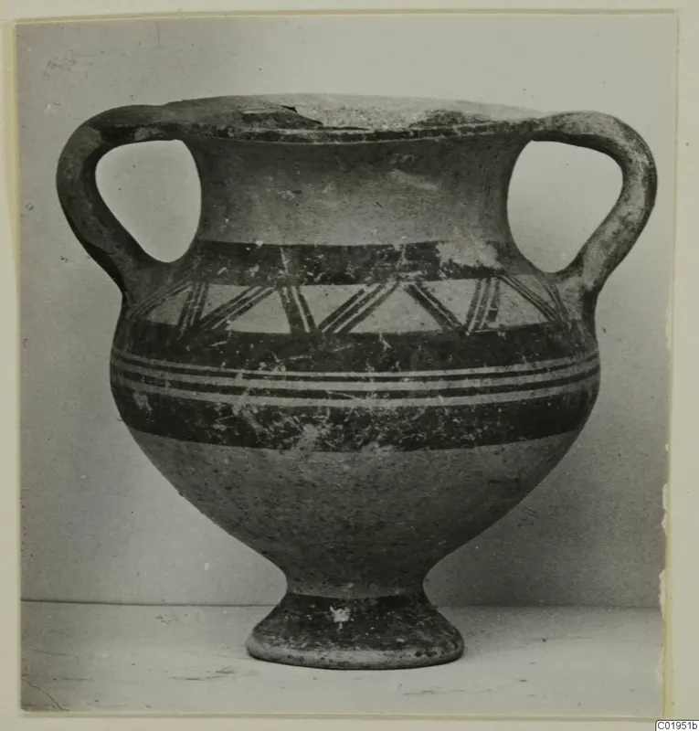 Two-handled pottery vessel with dark painted bands and a triangular pattern on the shoulder, shown in front view