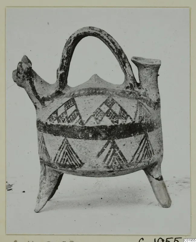 Pottery White Painted I jug from Lapithos, with strap handle, three legs and dark painted triangles and bands