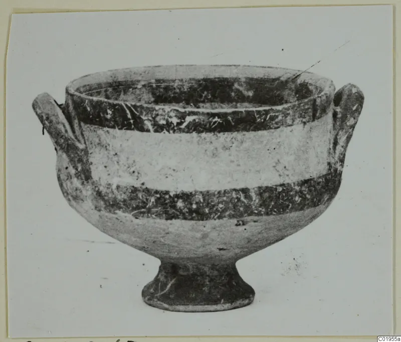 White Painted I bowl from Lapithos, shown from the side with two handles and a footed base