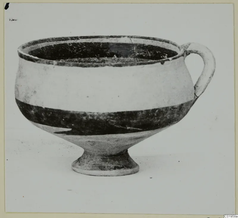 White Painted I bowl from Lapithos, Kastros tombs: a footed bowl with one loop handle and a dark painted band