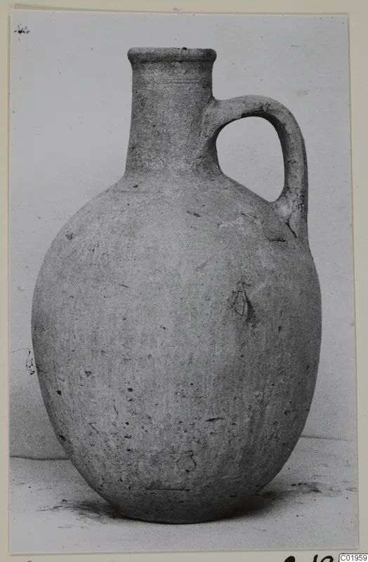 Pottery jug with a single loop handle and tall neck, from the Kastros tombs at Lapithos