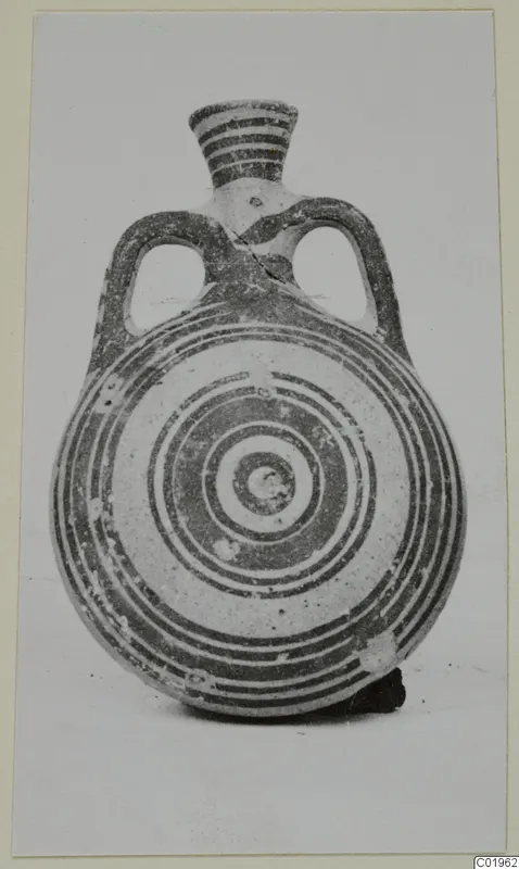 Pottery Bichrome II flask with a flattened round body, concentric painted rings, two loop handles and a banded neck