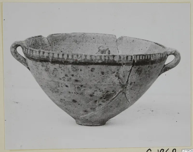 White Painted I bowl with two loop handles and a dark painted band below the rim
