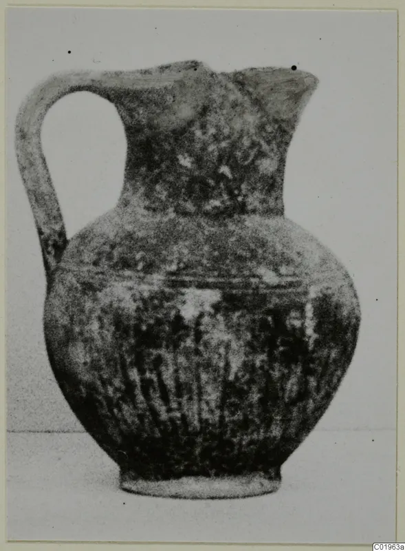 Black Slip Ware jug with a looped handle and vertically grooved body, from Lapithos, Kastros tombs