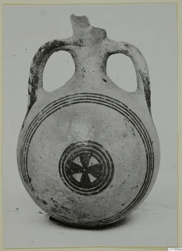 Two-handled White Painted II pottery flask with concentric bands and a central star-shaped motif on its body