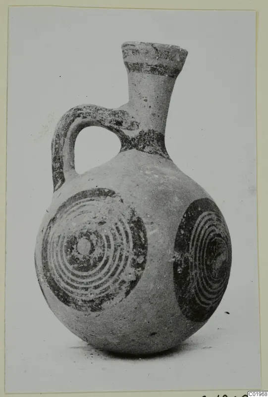 Small jug with a flaring neck, loop handle and dark concentric circles on its body, from the Kastros tombs at Lapithos