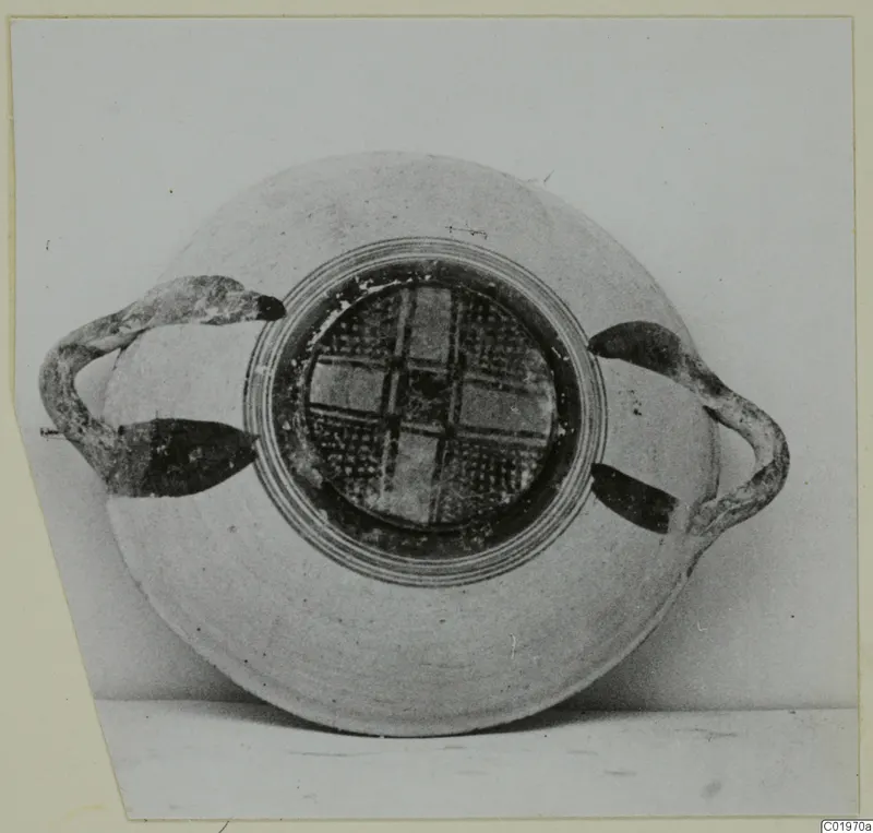 White Painted I bowl with two side handles, photographed against a plain grey background, from Lapithos Kastros tombs