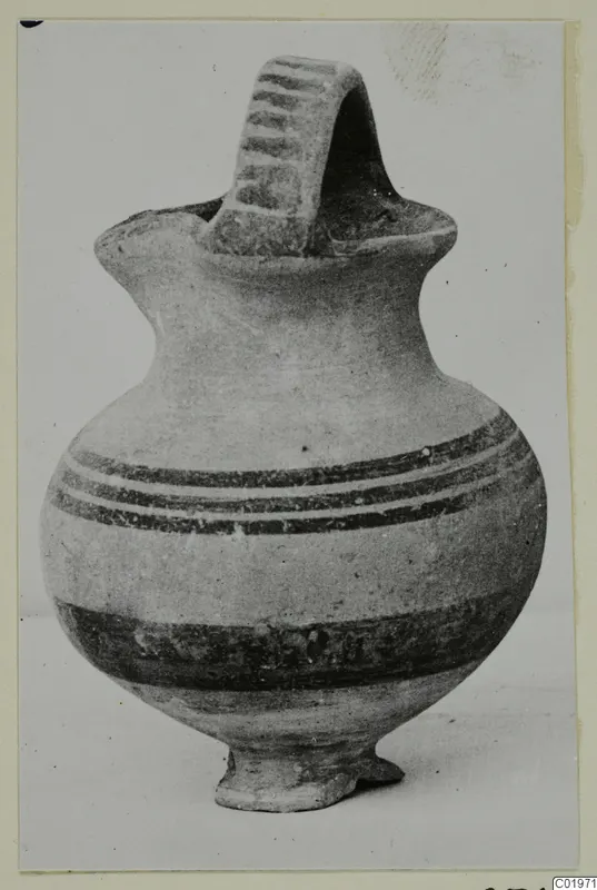 White Painted I jug from Lapithos with a broad strap handle and dark painted bands on the body