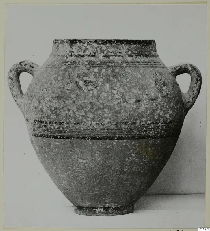 Two-handled pottery jar with dark painted bands and concentric circle motifs, from the Kastros tombs at Lapithos