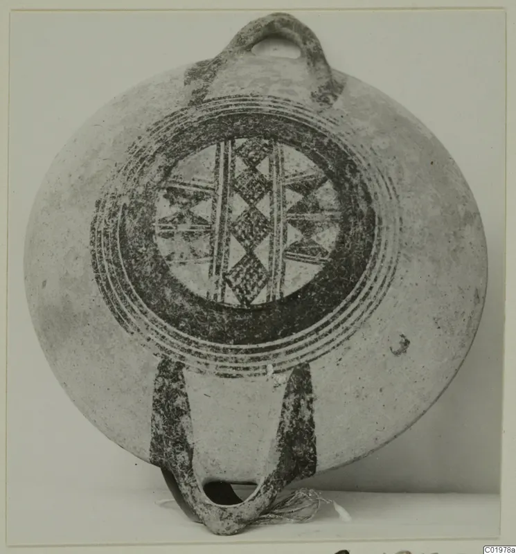 Pottery White Painted I bowl from Lapithos, Kastros tombs, with painted concentric rings and a central cross-hatched pattern