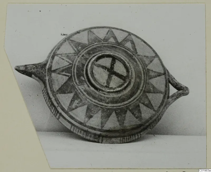 Round pottery vessel with a pointed spout and handle, painted with radiating dark triangles, from Lapithos Kastros tombs