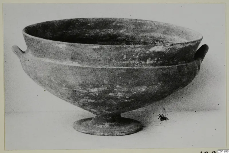 Footed bowl with two small horizontal handles on a plain background, Foreign Red Slip