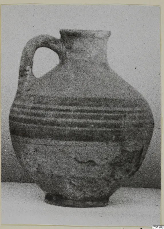 Jug with a looped handle and dark horizontal bands on the body, White Painted I - II pottery