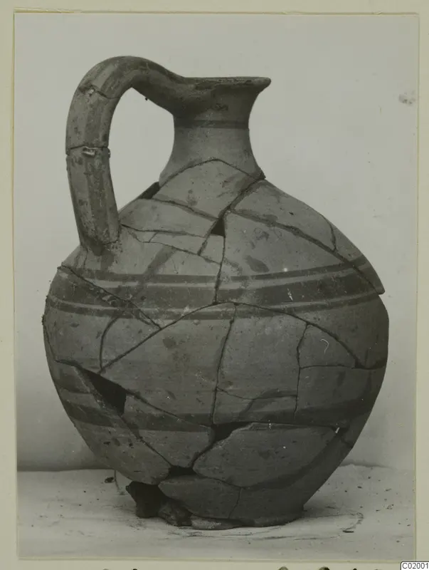 White Painted VI jug, a reconstructed pottery vessel with a strap handle and dark painted bands